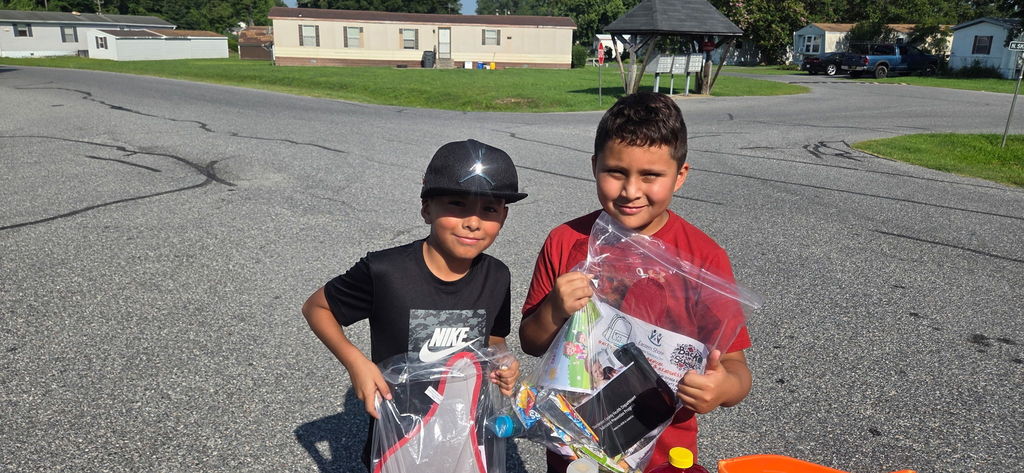 Two Boys holding bags