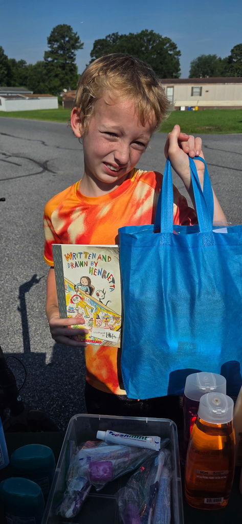 boy holding bag