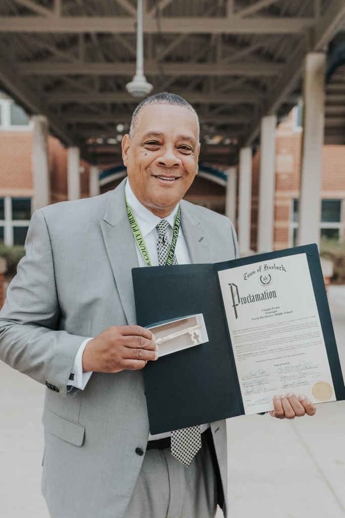 Principal Evans of NDMS receives a proclamation and key from the town of Hurlock