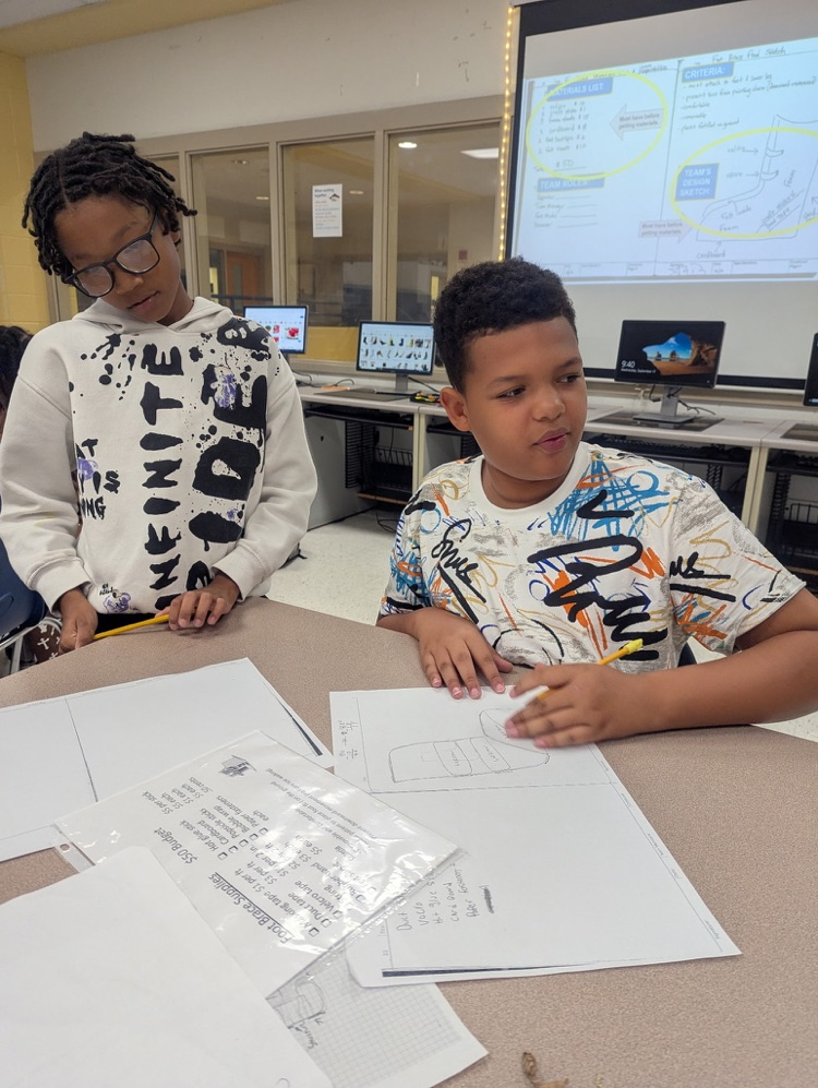 students in PLTW engage in group tasks