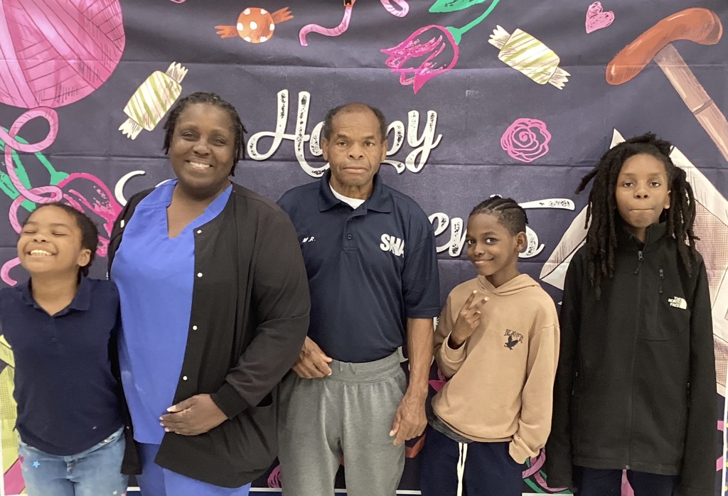 Grandparents pose with grandchildren