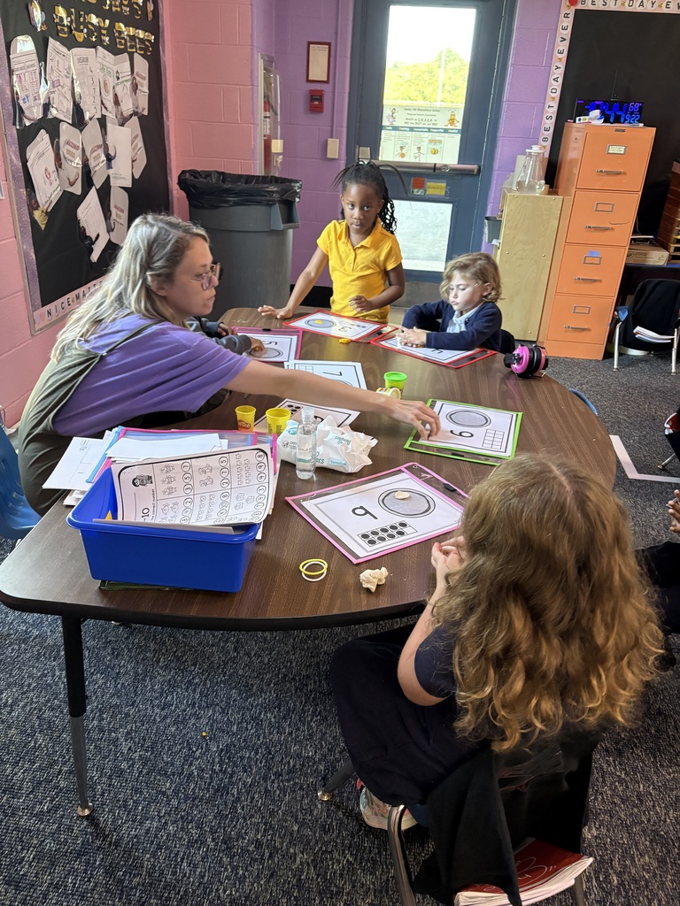 Teacher with students counting