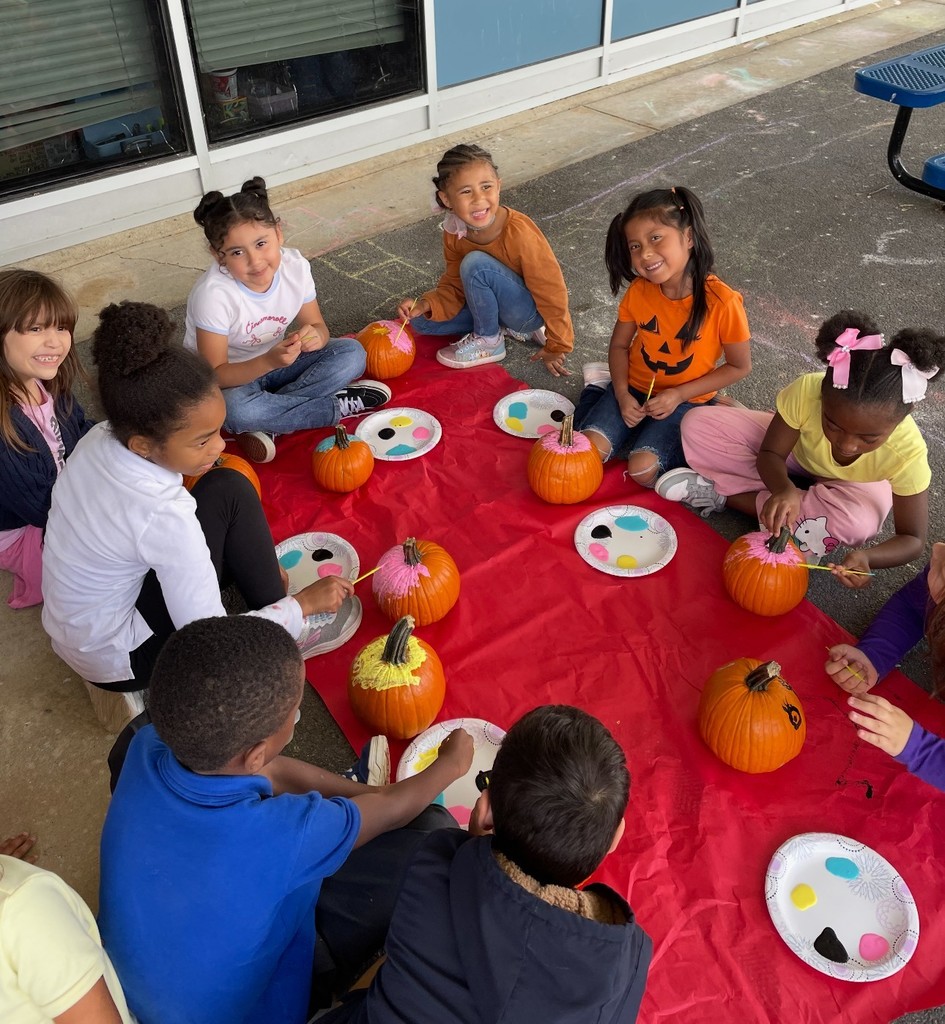 kids painting pumpkin