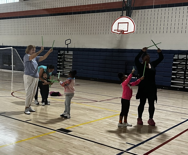 students and families doing yoga