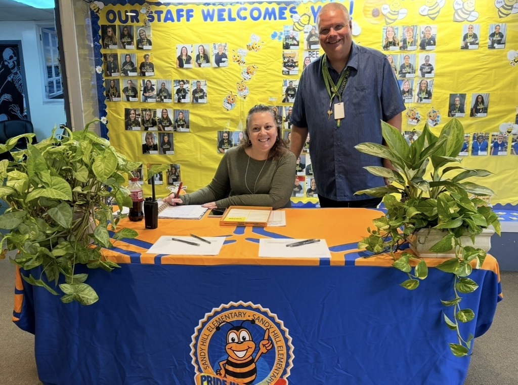 Coach and counselor greeting parents 