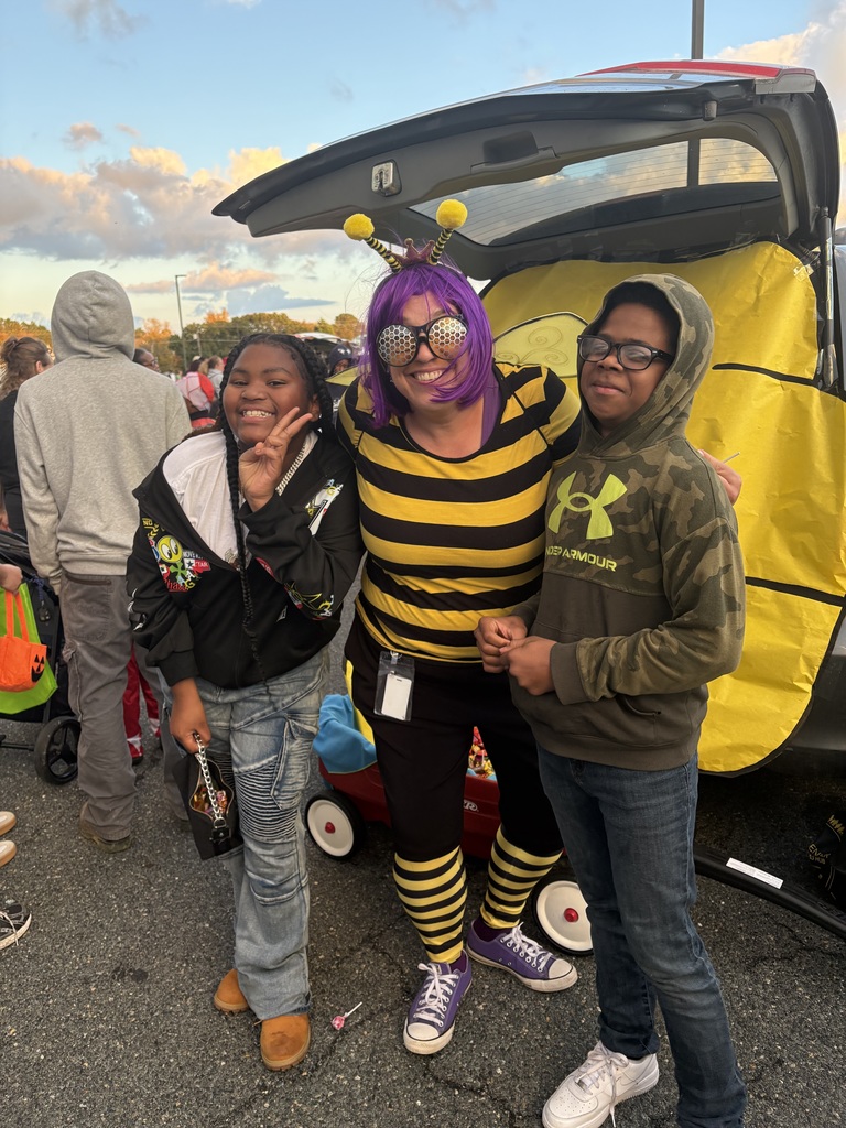 Asst principal and students at trunk or treat