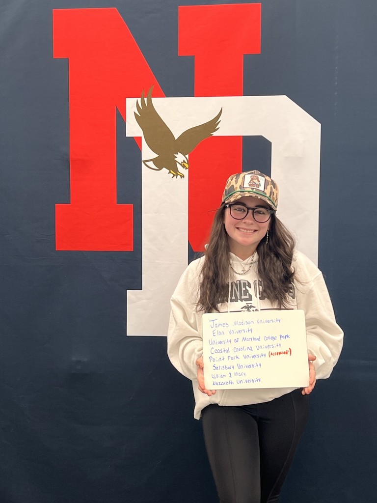 Student holding a placard