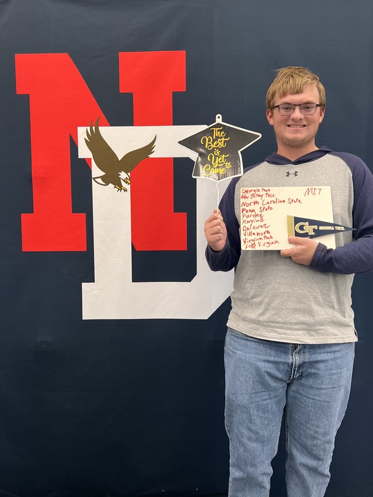 Student holding a placard