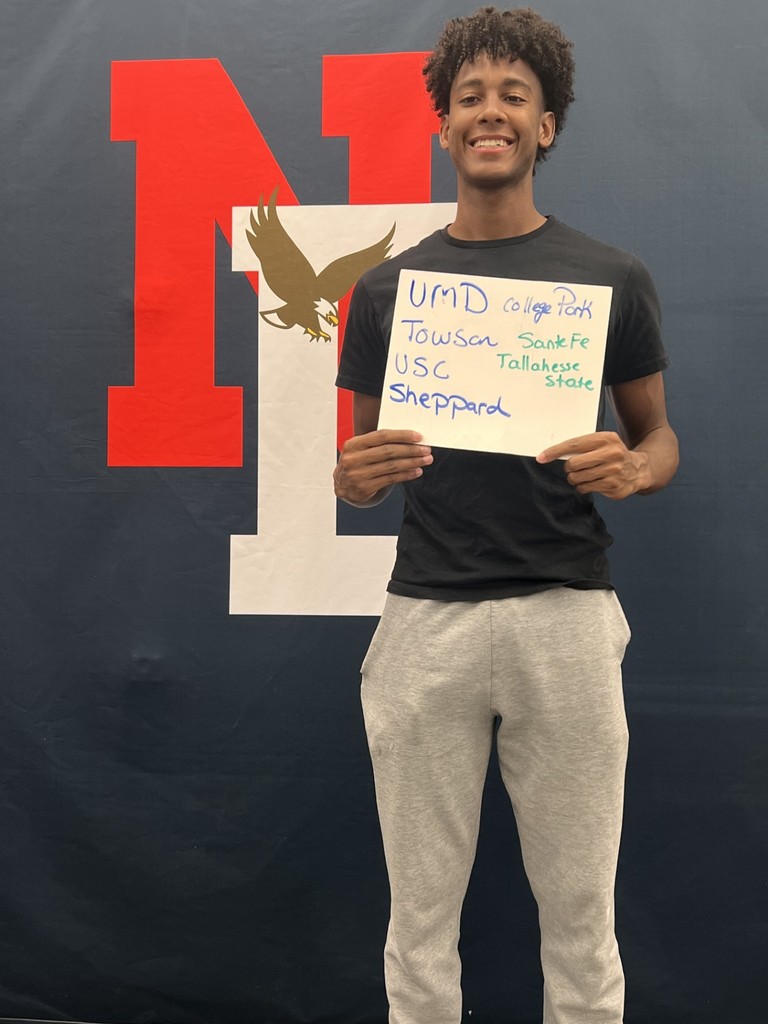 Student holding a placard