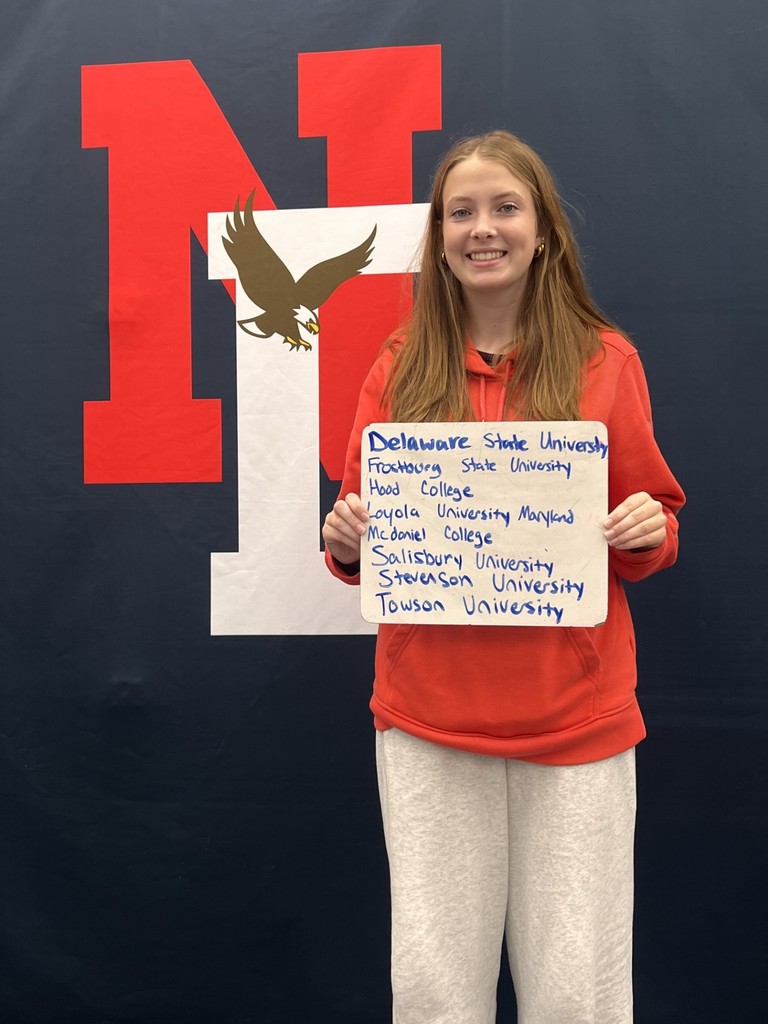 Student holding a placard