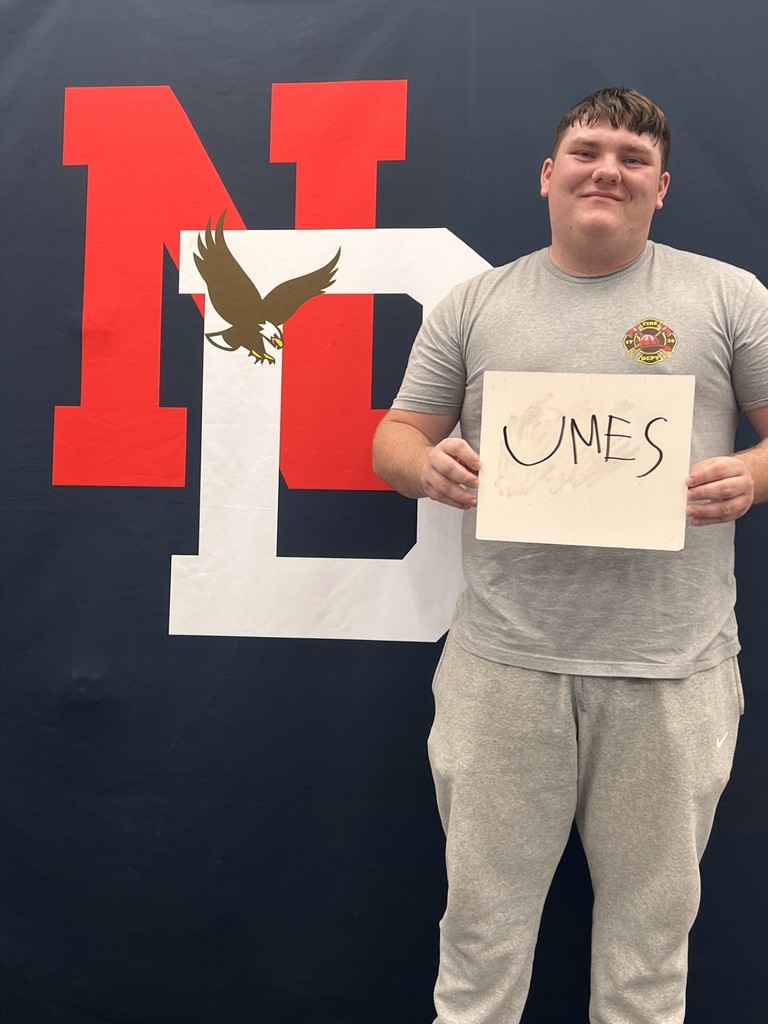 Student holding a placard