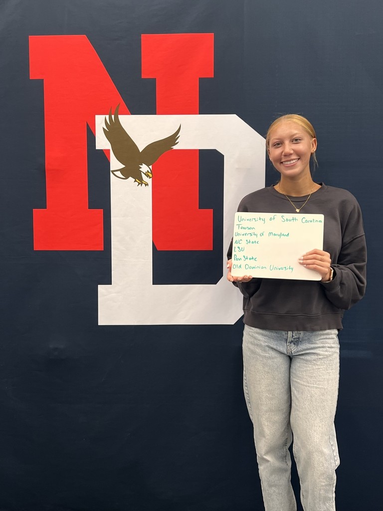 Student holding a placard