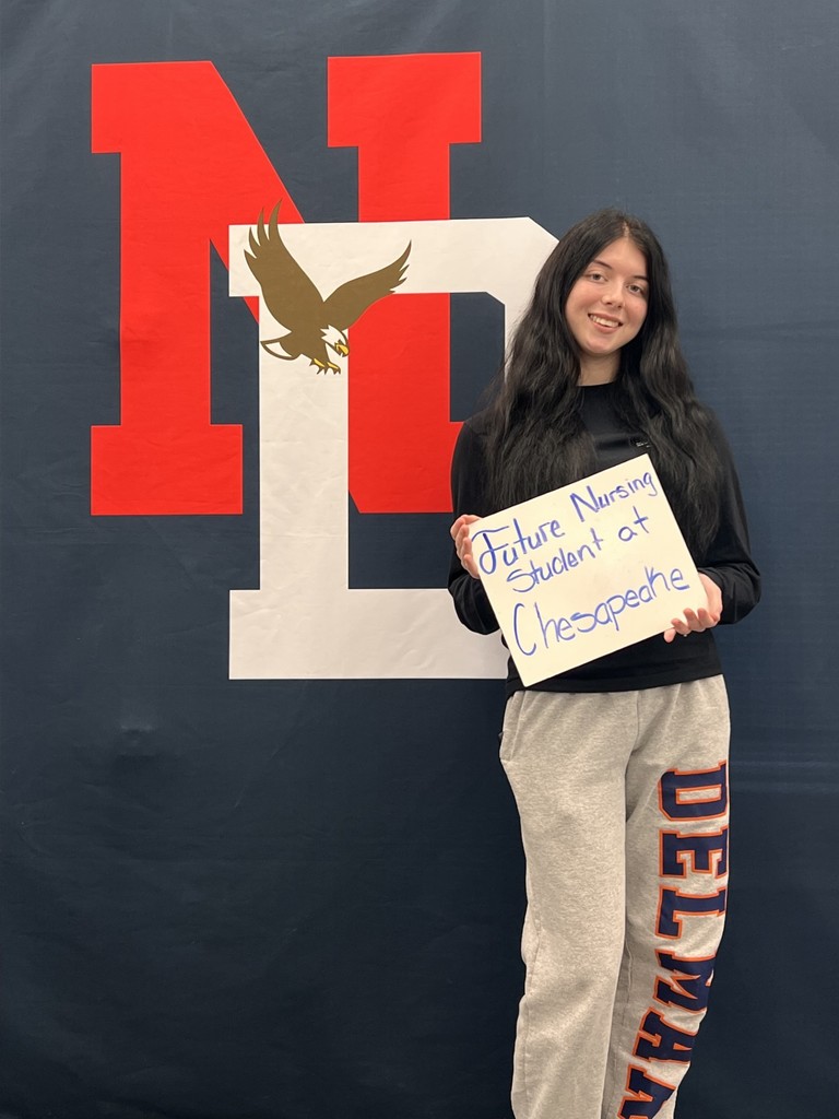 Student holding a placard