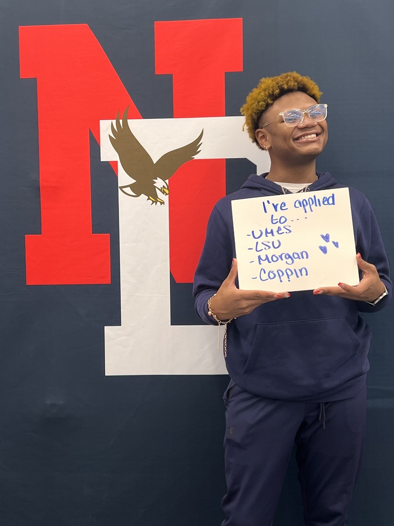 Student holding a placard