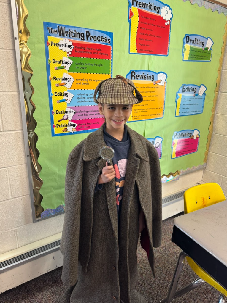 student holding magnifying glass