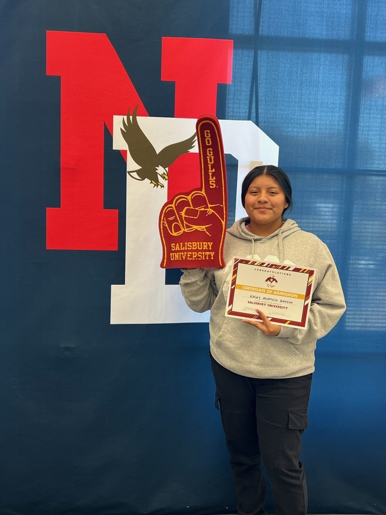 student holding a certificate