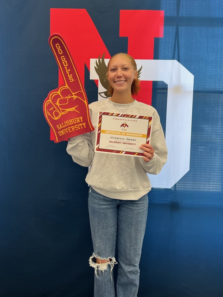 student holding a certificate