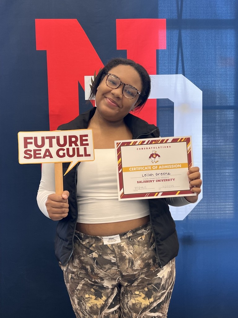 student holding a certificate