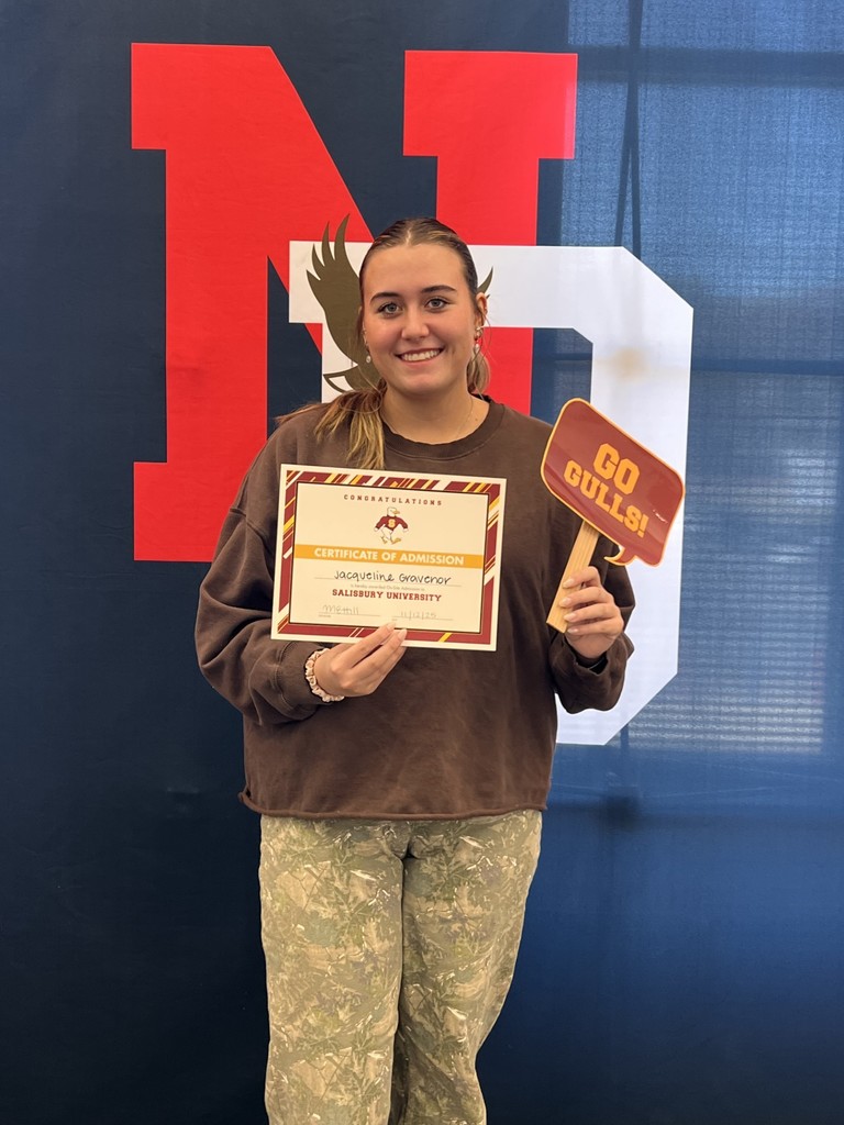student holding a certificate