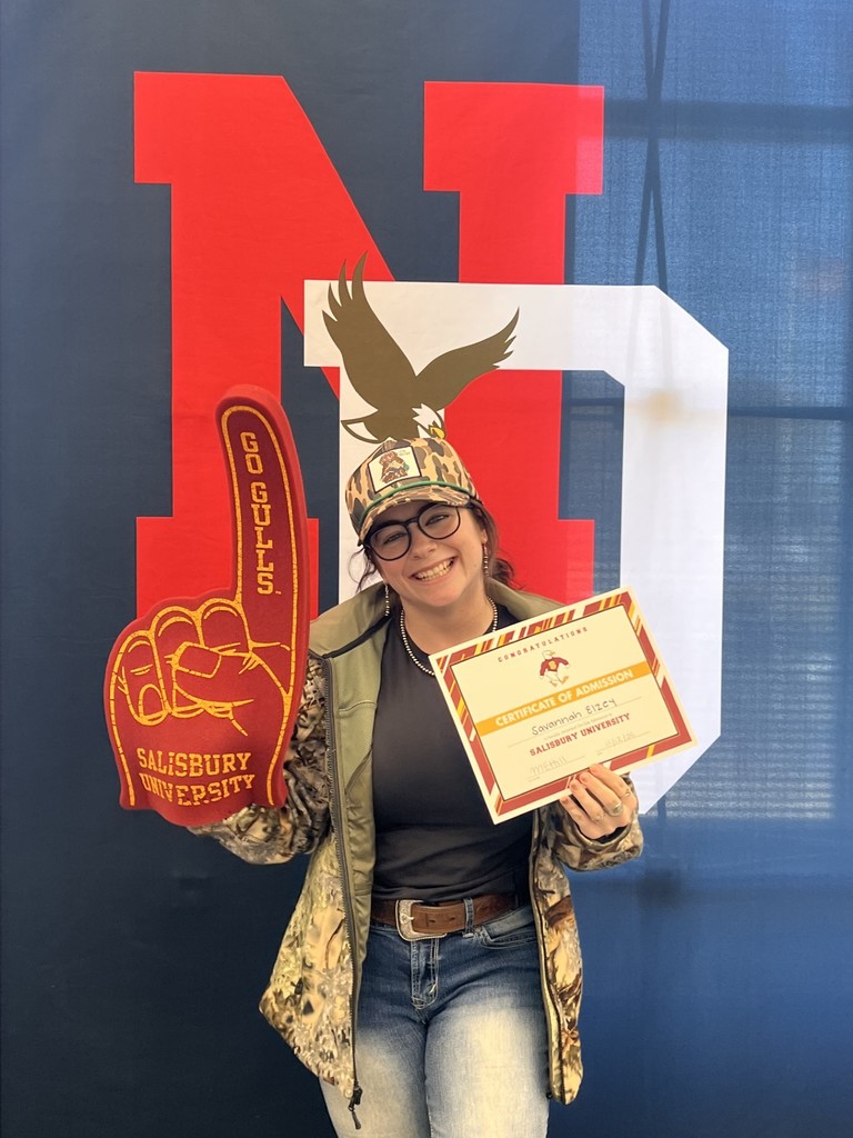 student holding a certificate