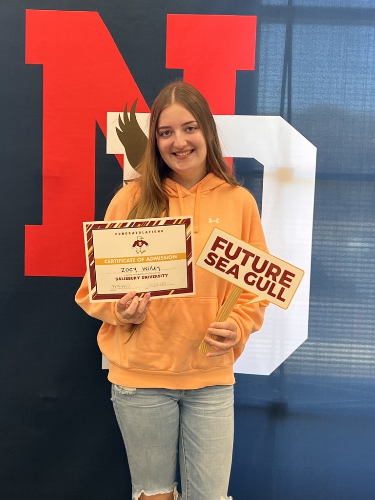 student holding a certificate