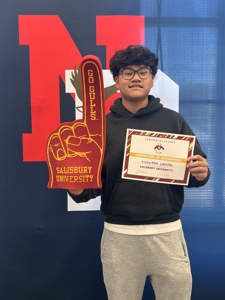 student holding a certificate