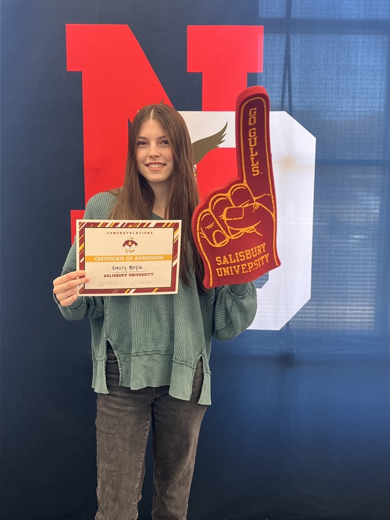 student holding a certificate