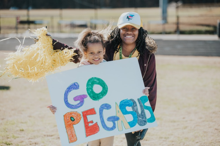 MES 7v7 football house rally at Viking Stadium