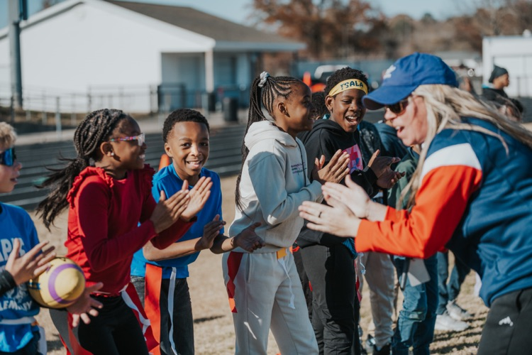 MES 7v7 football house rally at Viking Stadium