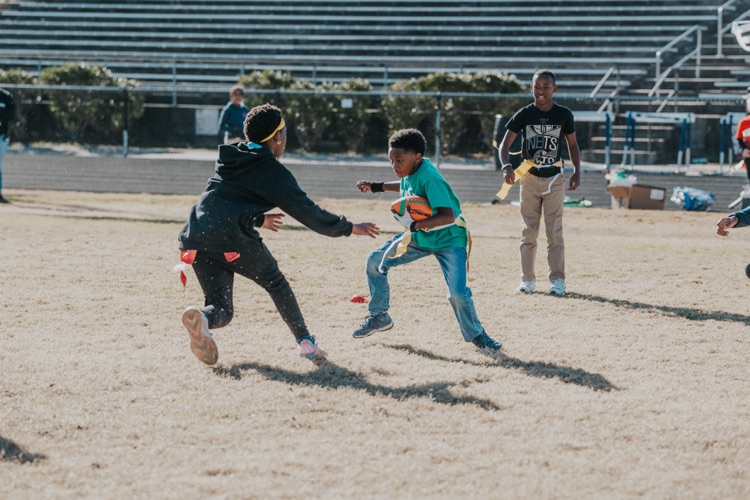 MES 7v7 football house rally at Viking Stadium