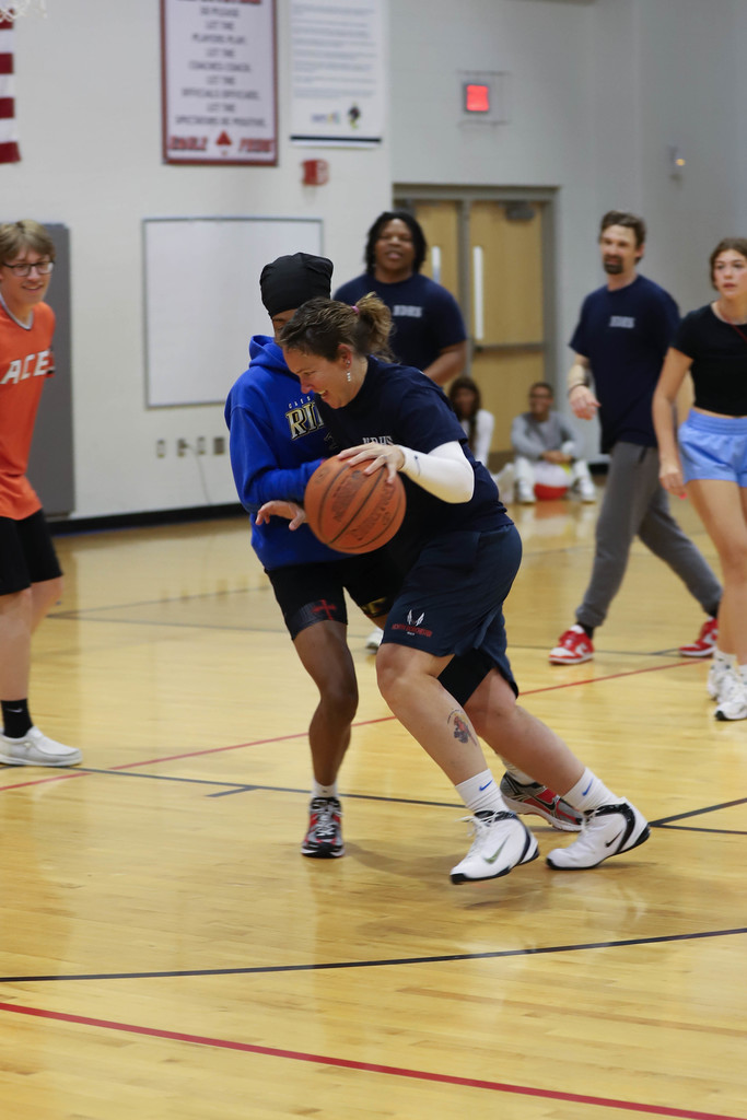 Trainer Mary shows them how to drive to the basket!
