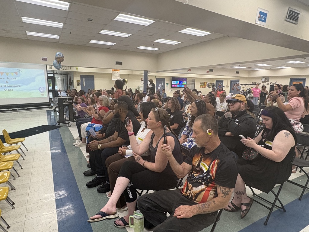 Parents watching their students perform
