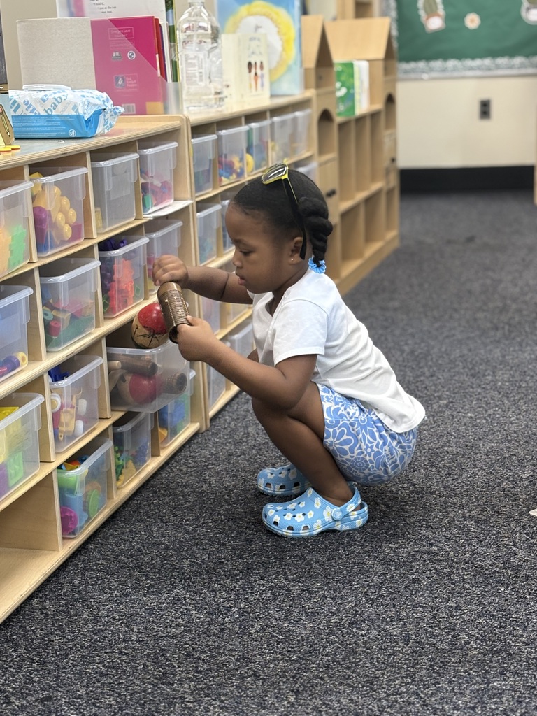 Student playing with toys at Open House