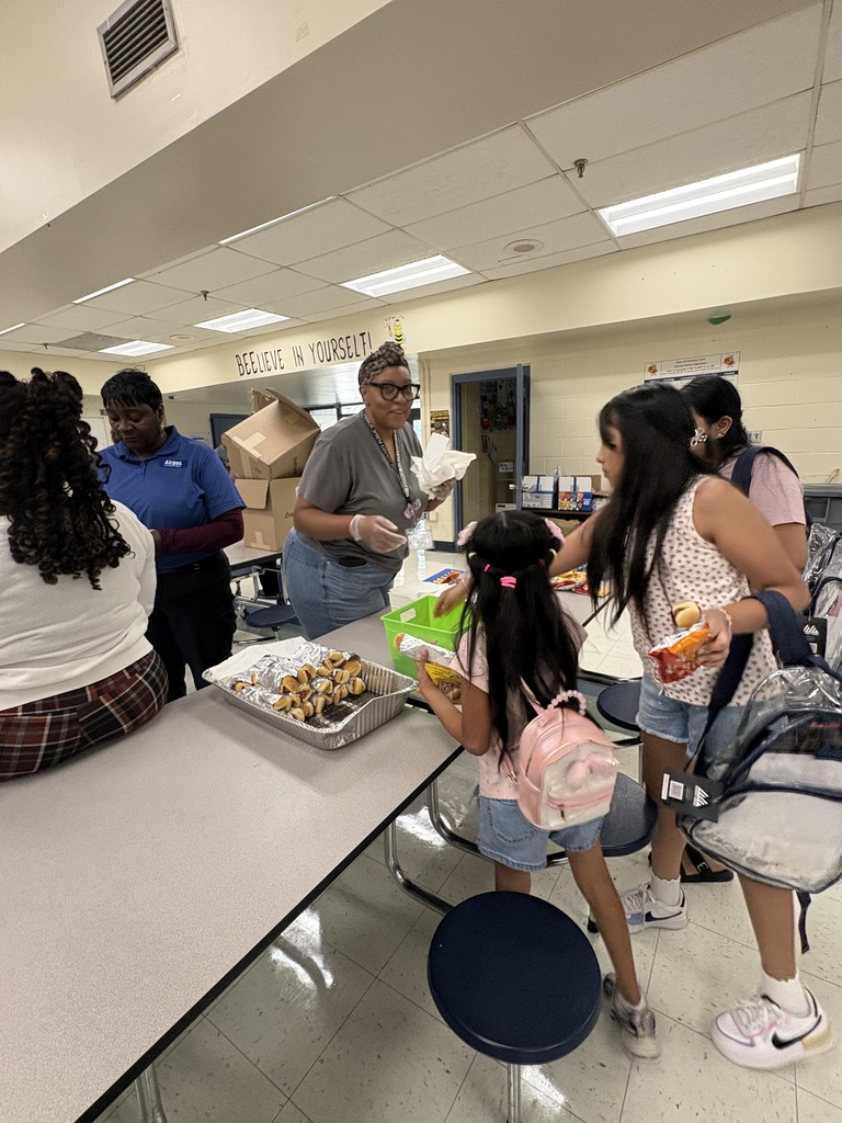 ms Greene serving hotdogs at open house