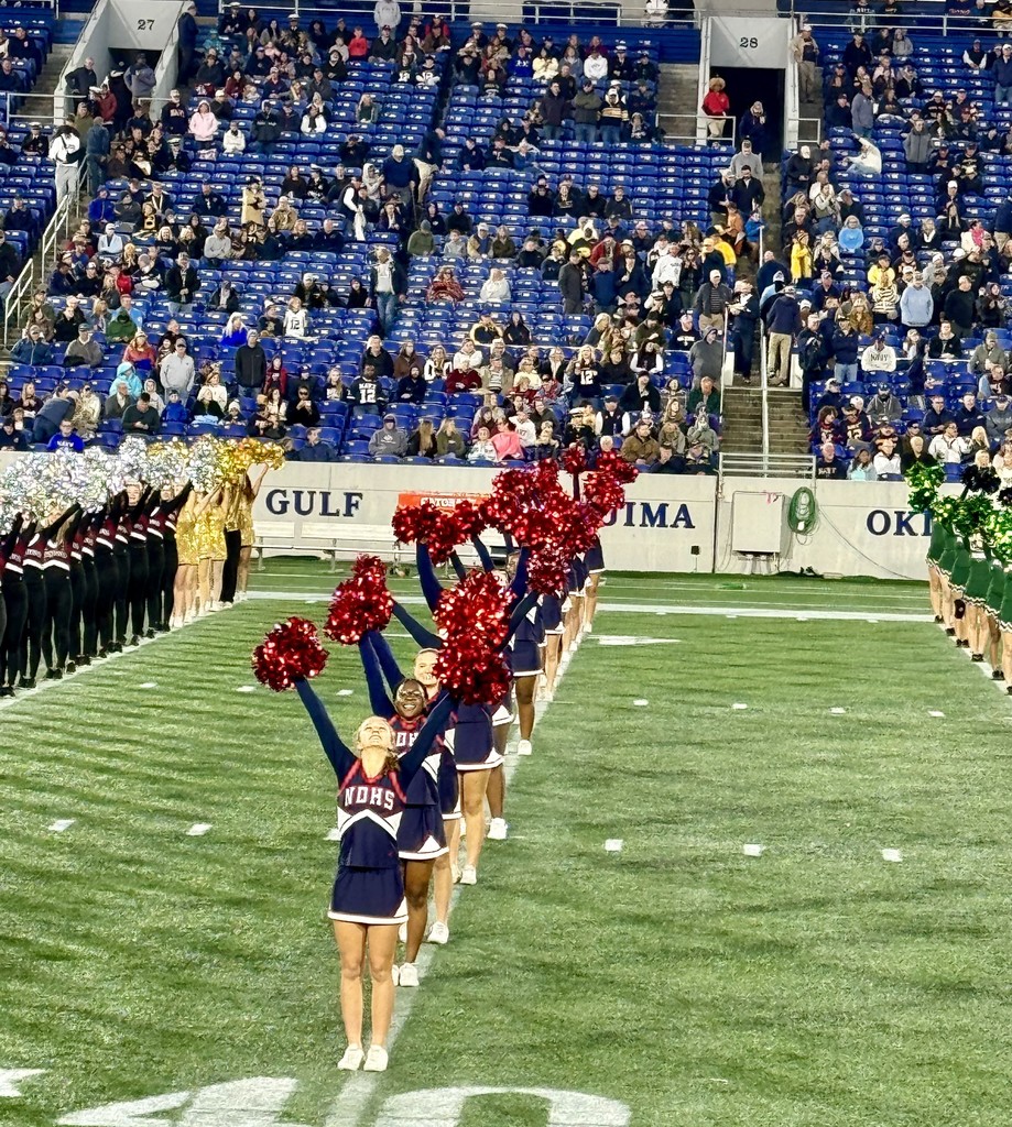 Cheer team performing on the field