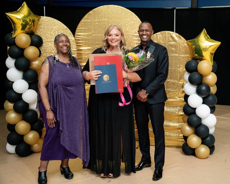 Early Excellence Educator of the year standing with the Board of Ed President and Superintendent