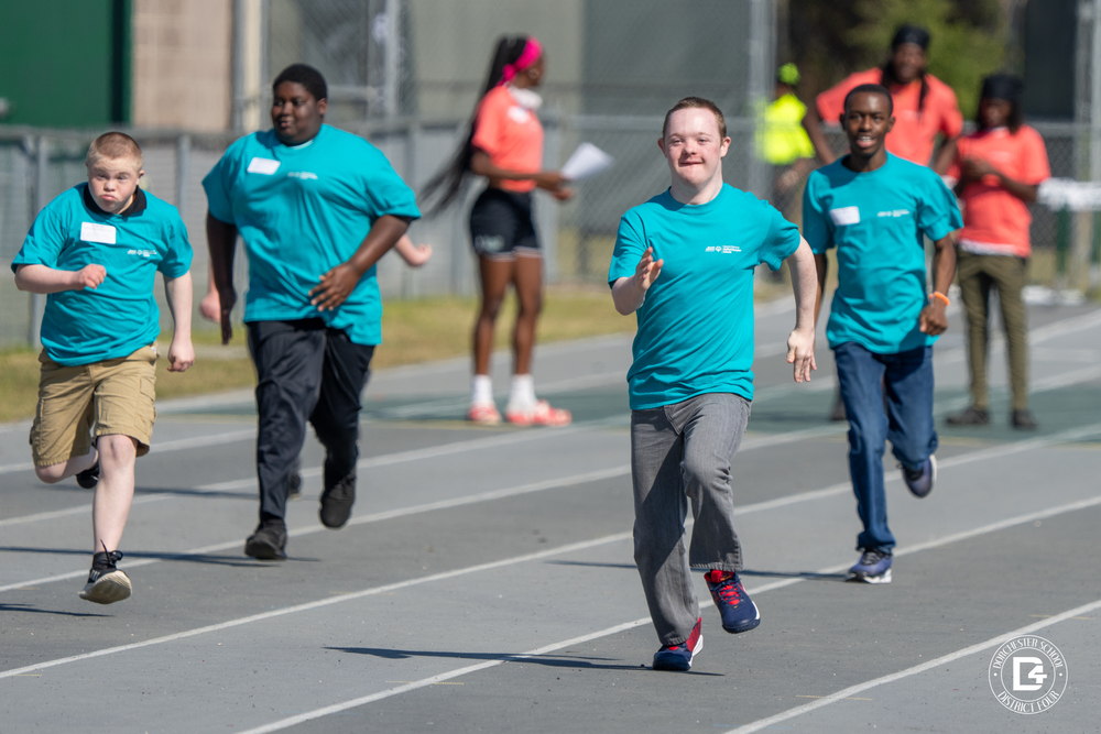 Student running track