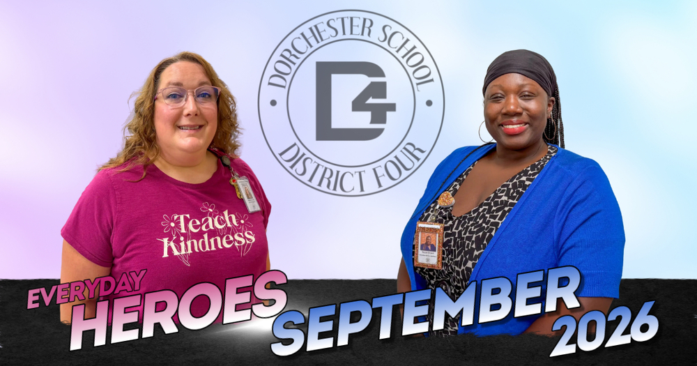 Everyday Heroes September 2026 graphic for Dorchester School District Four. Two smiling staff members stand on either side of the district's circular D4 logo against a soft purple and blue background. On the left, a woman with curly hair and glasses wears a magenta "Teach Kindness" T-shirt and a district ID badge. On the right, a woman in a black headwrap and hoop earrings wears a bright blue cardigan over a patterned top with a district ID badge. Bold text across the bottom reads "Everyday Heroes September 2026."