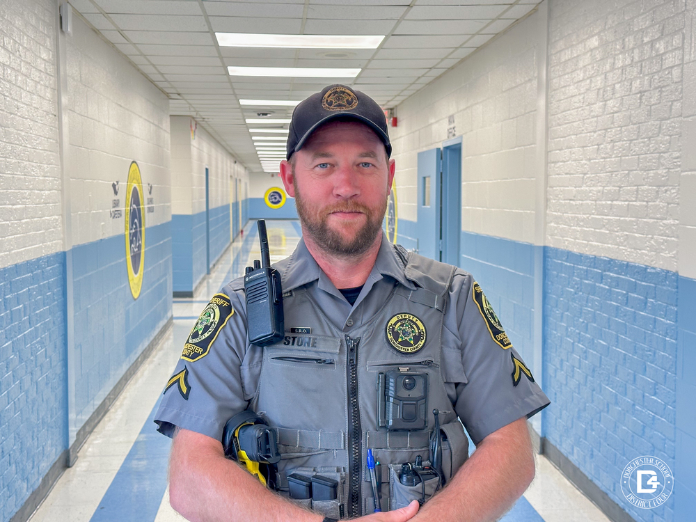 Photo of Officer John Stone in the hallway at HES