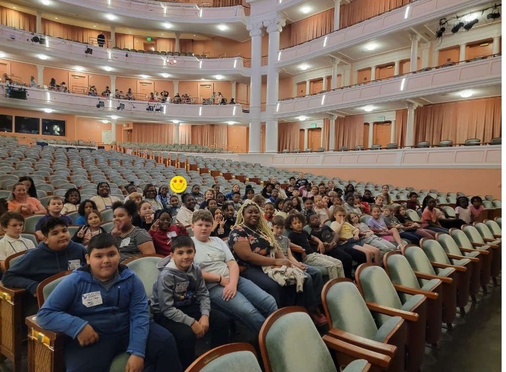 students sitting in auditorium