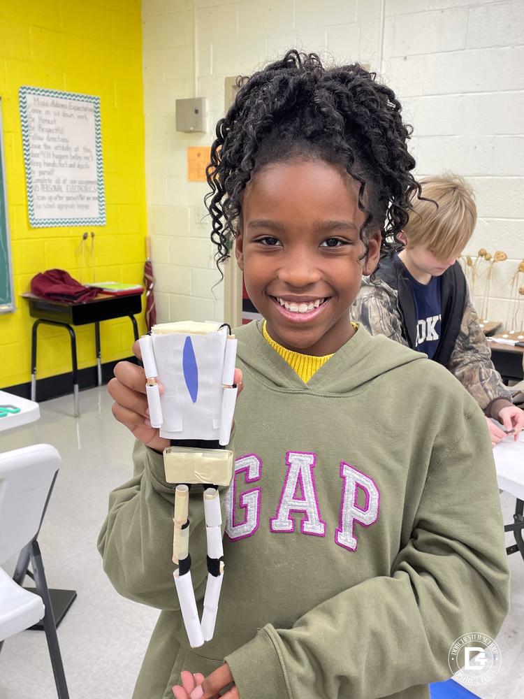 WMES Student showing off her art work