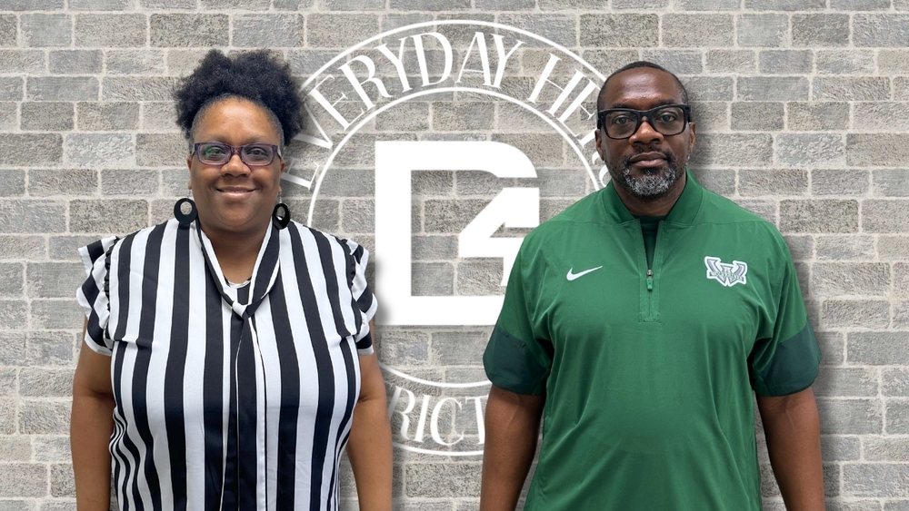 Tiffany Strong-Moorer and Coach Eddie Ford stand side by side in front of a brick wall with the Dorchester School District Four Everyday Hero logo behind them. Strong-Moorer wears a black-and-white striped blouse, while Ford wears a green Woodland Wolverines athletic pullover with glasses.