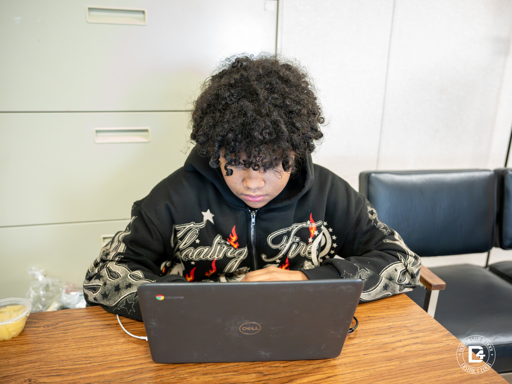 Student engaged in the Career One on One virtual event, focused on their laptop screen during a career exploration session.