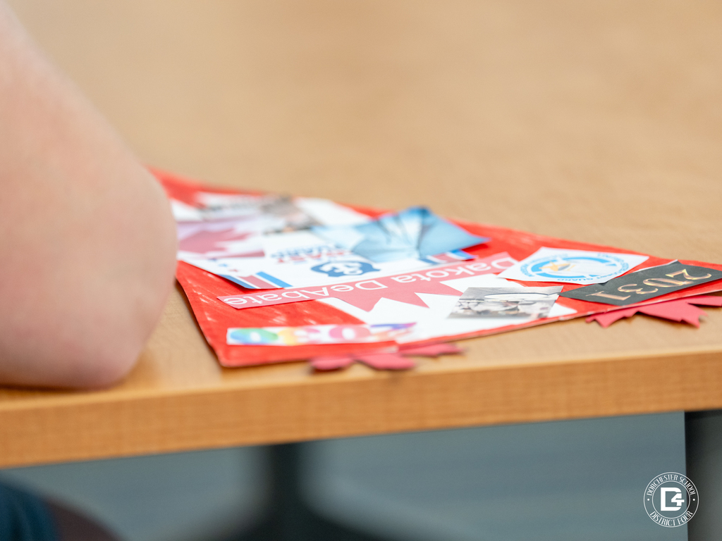 Close-up of a handmade student pendant displayed on a table, created as part of a project about personal goals and future aspirations.