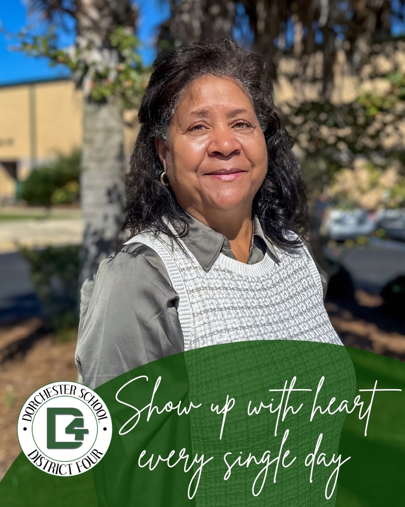A DD4 staff member smiles warmly outdoors on a sunny day, with the text "Show up with heart every single day" and the Dorchester School District Four logo overlaid at the bottom.