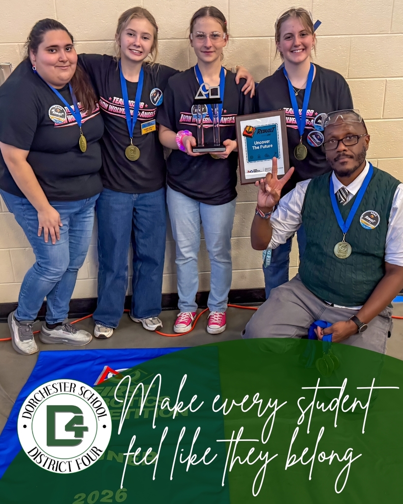 A DD4 teacher celebrates with four students wearing medals and holding a trophy at a robotics competition, with the text "Make every student feel like they belong" and the Dorchester School District Four logo overlaid at the bottom.