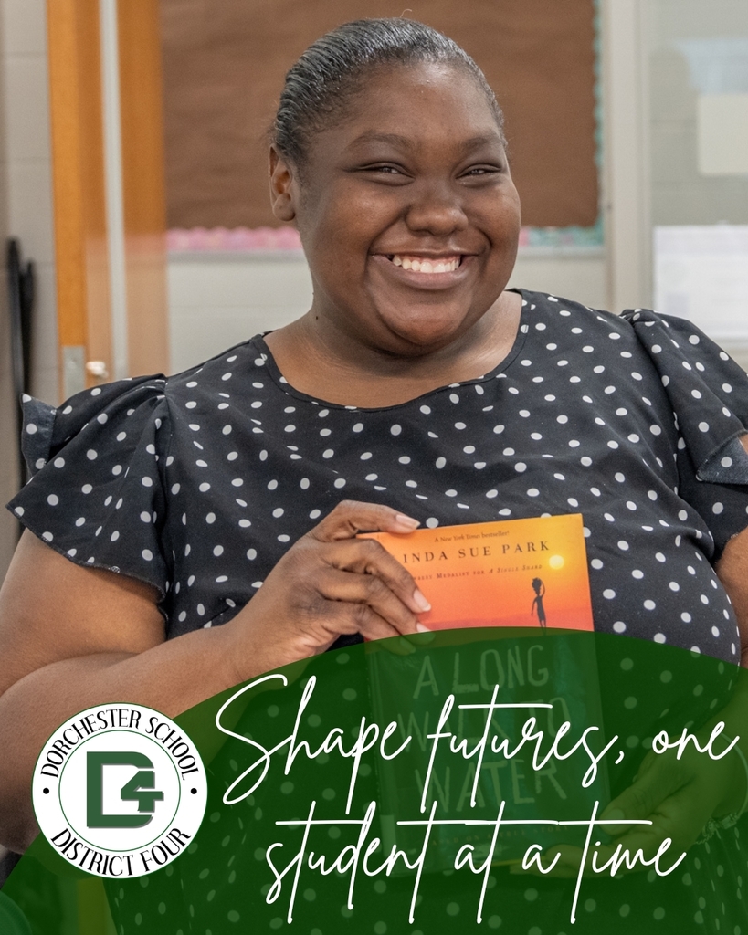 A DD4 teacher smiles joyfully while holding a book in a classroom setting, with the text "Shape futures, one student at a time" and the Dorchester School District Four logo overlaid at the bottom.