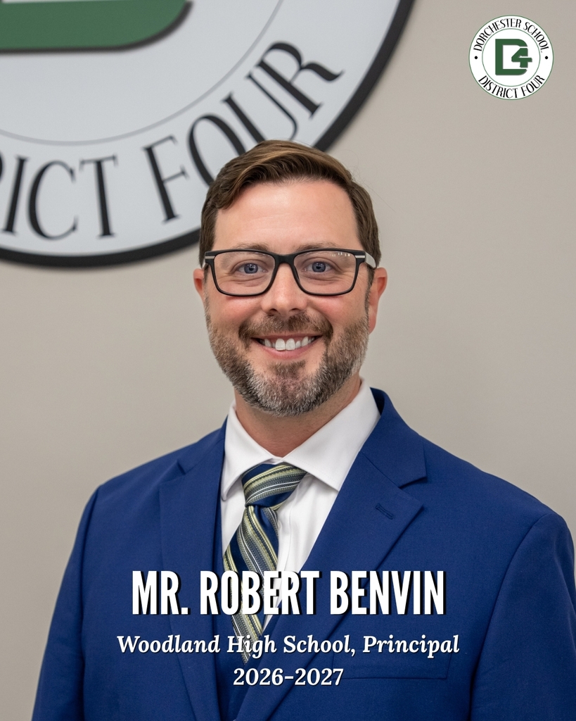 Portrait of Mr. Robert Benvin, Principal of Woodland High School for the 2026-2027 school year. He is smiling and facing the camera, wearing glasses, a blue suit jacket, white dress shirt, and striped tie. The background includes part of the Dorchester School District Four seal, with the district logo displayed in the upper right corner. Text on the image identifies him as "Mr. Robert Benvin, Woodland High School, Principal, 2026-2027."