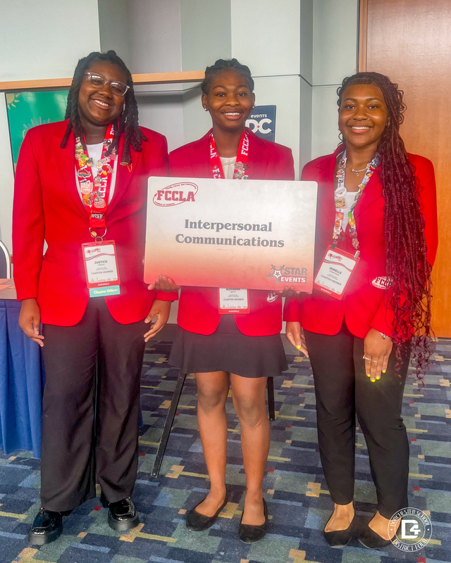 Three Woodland High School FCCLA students smile while presenting their Interpersonal Communications STAR Events project at the FCCLA National Leadership Conference in Washington, D.C.