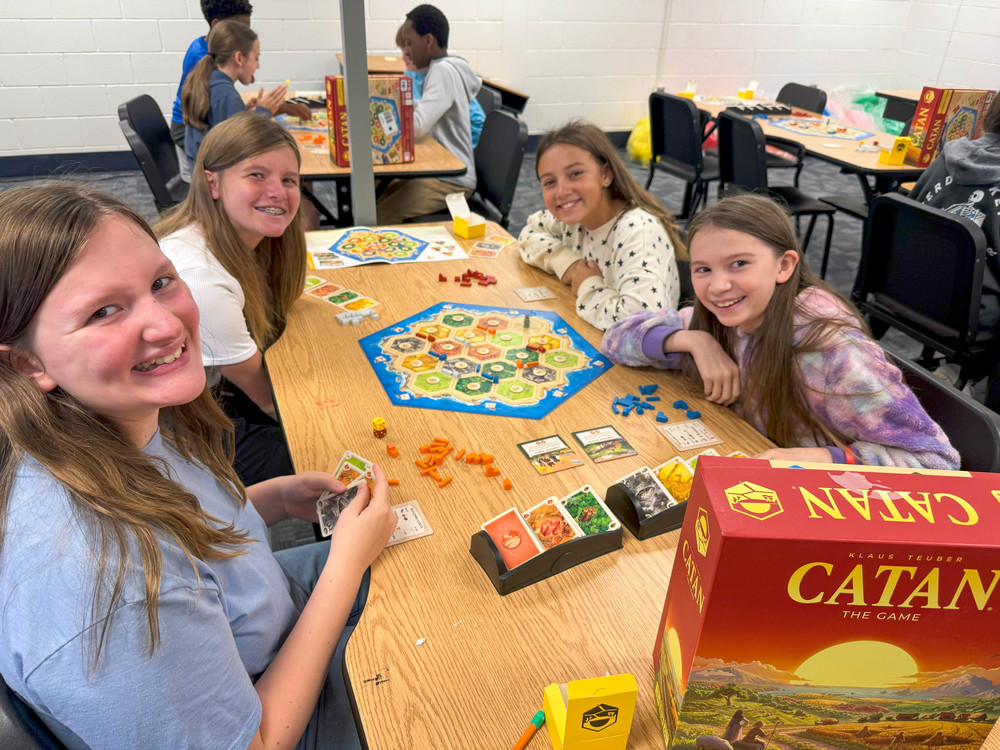 FMS students with the Catan game.